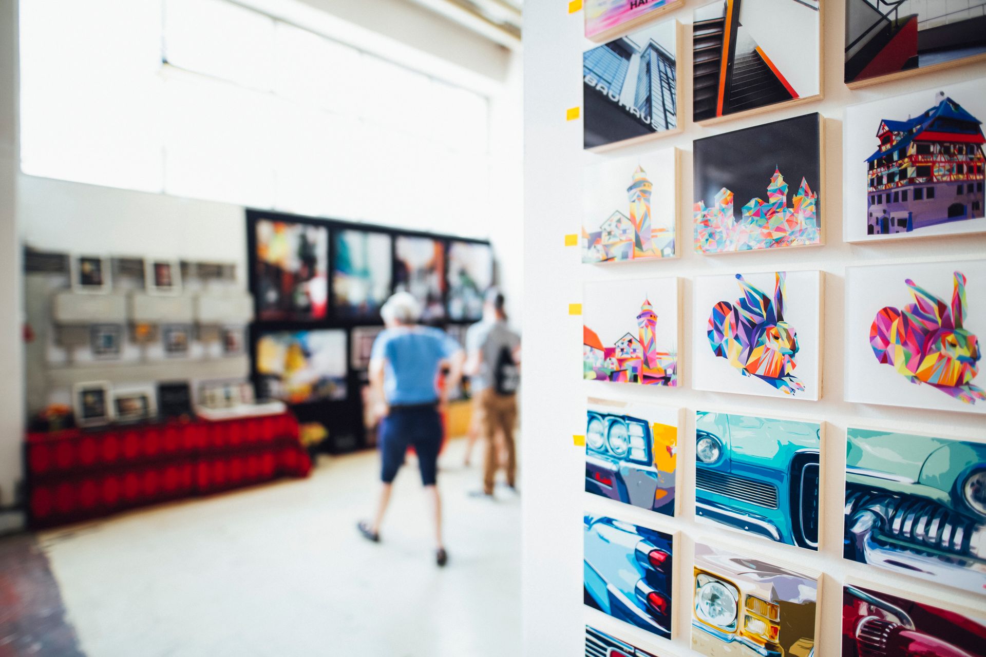 Photographs and artwork displayed in a gallery