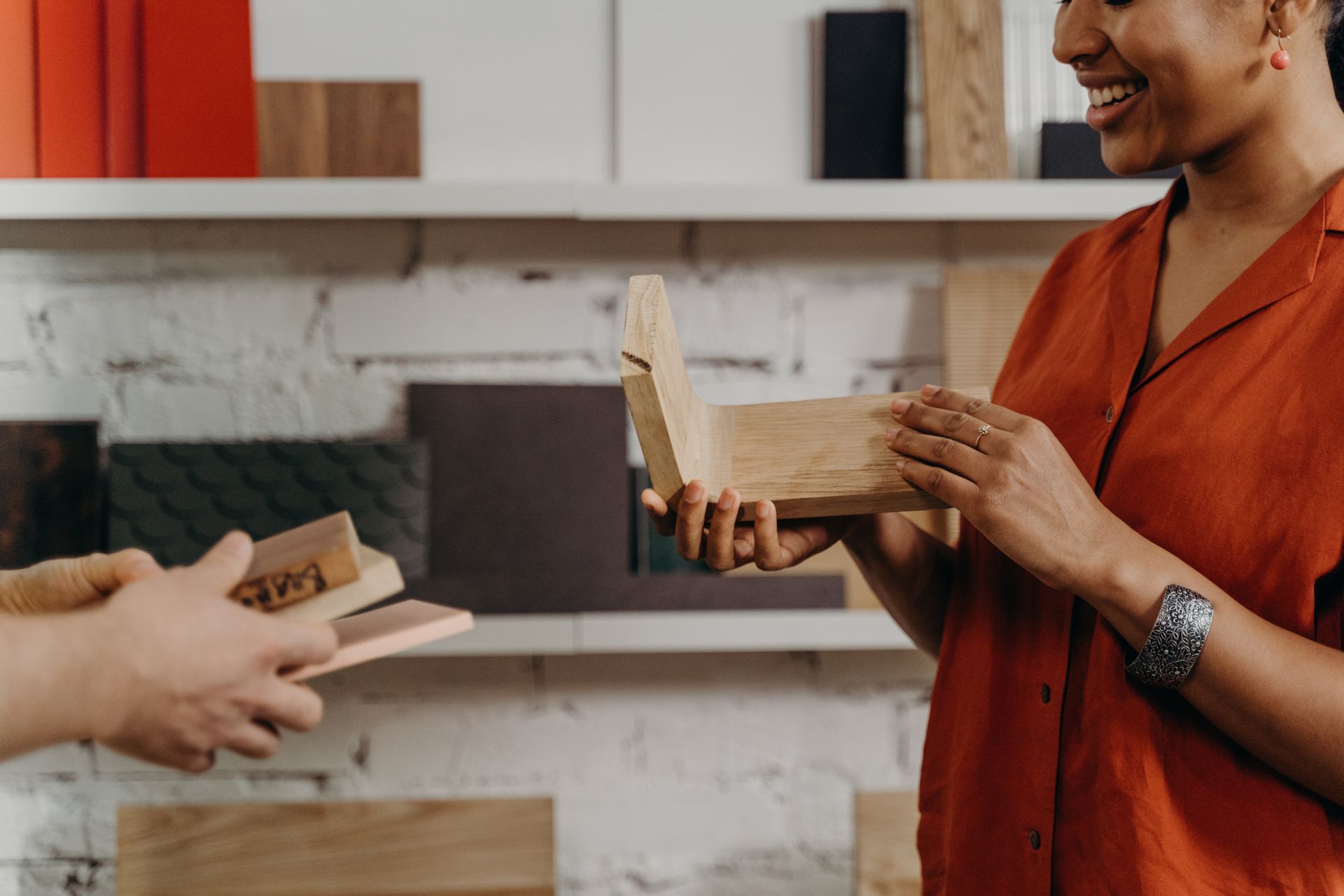 Smiling craftswoman presenting a wooden creation