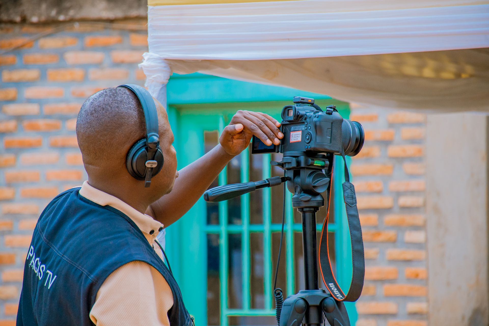 Camera operator working with a professional video camera